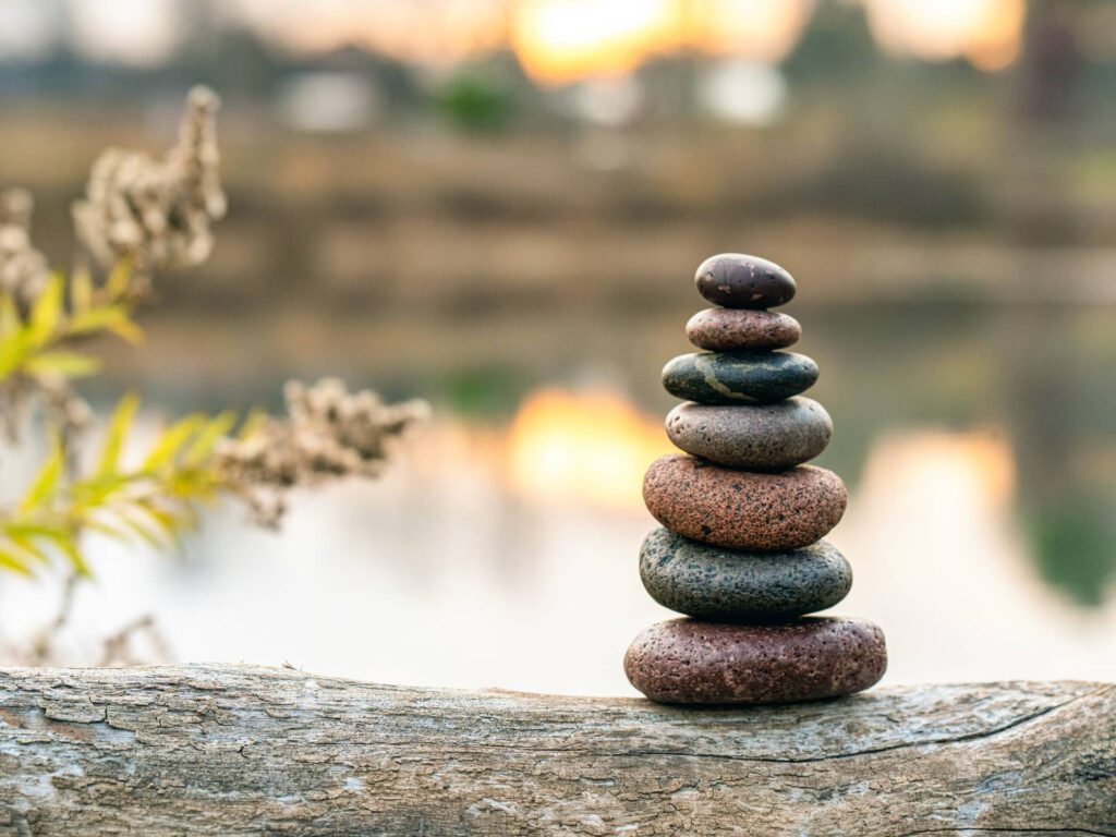 a stack of rocks on a log